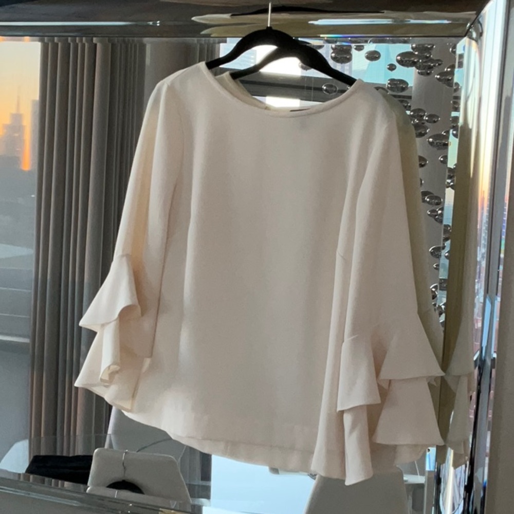 Classic cream bell sleeve top.